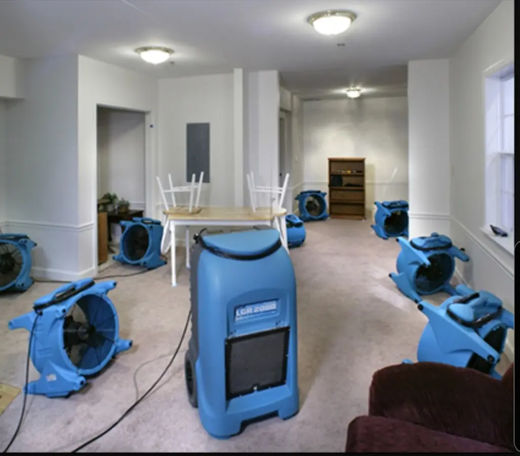 Air movers and dehumidifier setup for Water Damage Restoration in Asbury